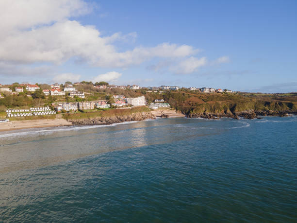 Looking Into Langland Bay in Gower, Wales, UK from the sea... Looking Into Langland Bay in Gower, Wales, UK from the sea on a clean late Autumn day. Blue skies with some clouds gower peninsular stock pictures, royalty-free photos & images