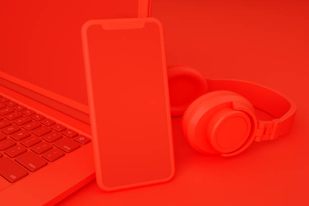 istock Blank Screen Smartphone and Laptop on Red Background 1287808496