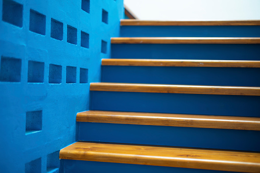 staircase with blue color wall