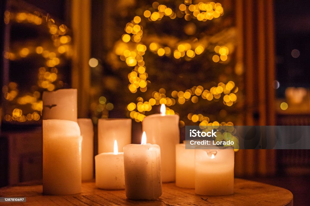 Christmas decorations in xmas home Stylish xmas festivities in a family home adorned with christmas decorations Candle Stock Photo