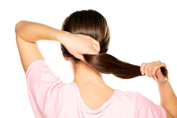 istock back view of woman is tying her tail 1287811268