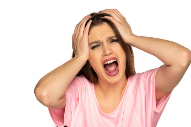 istock Young woman with strong headache on white backgroun 1287812359