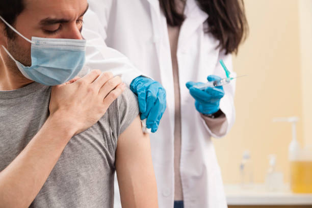 istock Vaccine and pandemics stills with people on a clinic environment. 1287814648