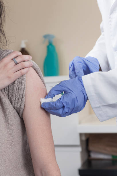 istock Vaccine and pandemics stills with people on a clinic environment. 1287814691
