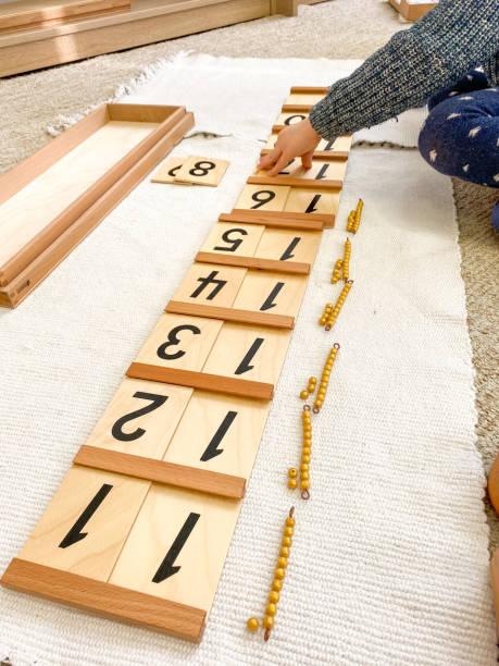 istock Montessori material blessing wood board 1 with golden material 1287816015