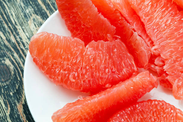 fresh grapefruit and slices background
