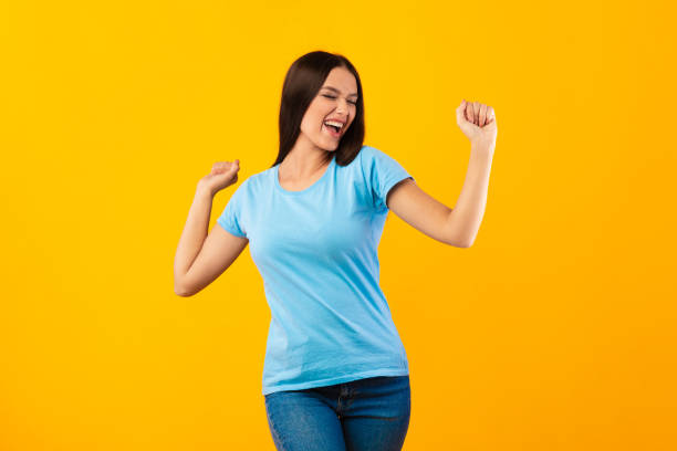 istock Smiling woman enjoying music and dancing at studio 1287822962