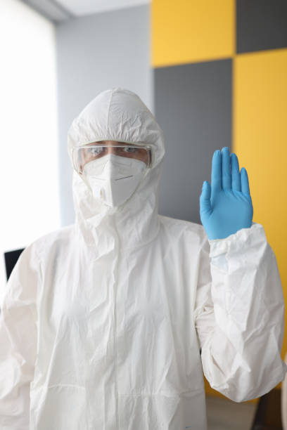 istock Medical officer in protective suit, mask and goggles. 1287824256