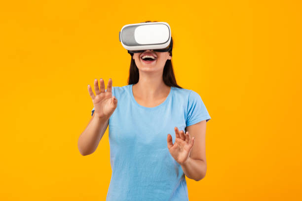 istock Woman wearing virtual reality headset at the studio 1287824505