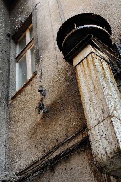 istock A filthy industrial wall stained with dirt with chimney inducing sadness 1287824835