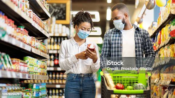 African Family In Shop Buying Groceries Wearing Face Masks Panorama Stock Photo - Download Image Now