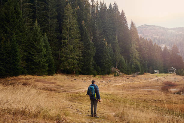 istock Male Hiker Enjoy Beautiful View 1287826340