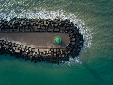 aerial view of a jetty at the entrance of the harbour of Scheveningen; The Hague, Netherlands