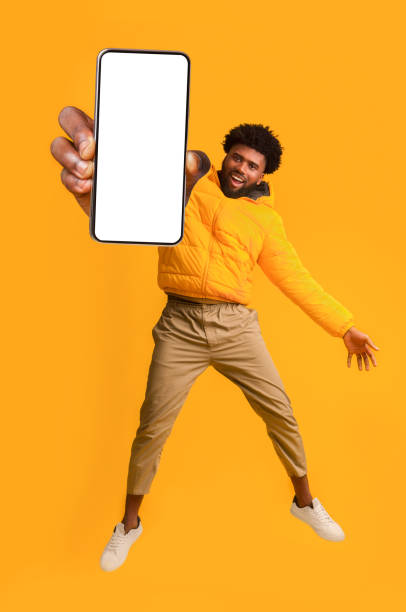 istock Handsome african american young man recommending new mobile application, collage 1287828024