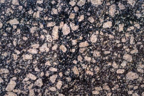 Natural texture of gray granite stone Construction material. Texture of natural black granite stone igneous rock stock pictures, royalty-free photos & images