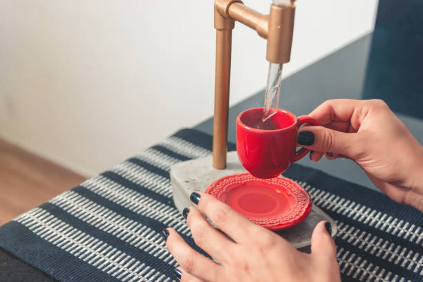 istock Girl preparing coffee at home 1287829440