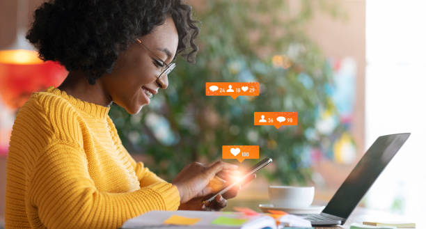istock African Lady Using Laptop Texting In Chat Sitting In Cafe 1287829921
