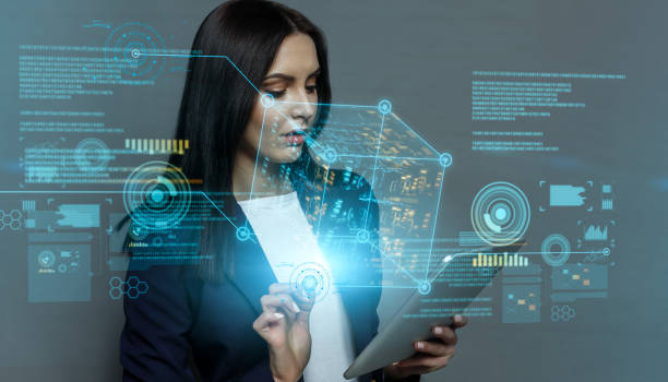 istock Futuristic cyber technologies. Collage with young business lady using tablet and virtual holograms with digital data 1287829991