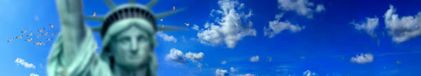 istock Close up Statue of Liberty over sunny blue sky 1287836947