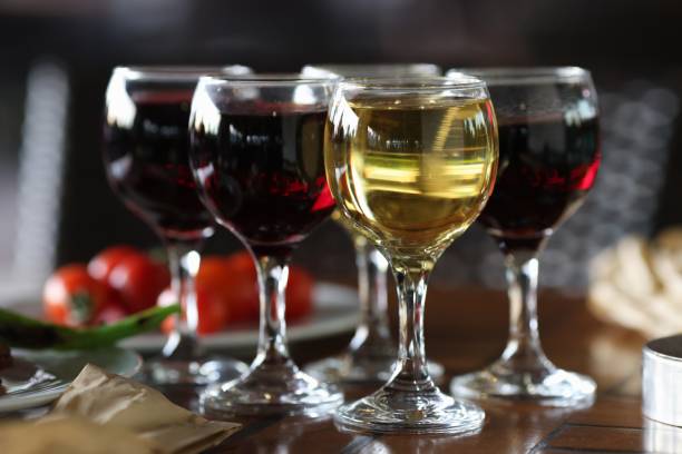 istock Four glasses of wine are on festive table. 1287838812