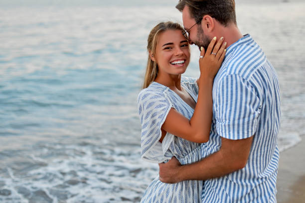 istock Couple on the beach. 1287838887