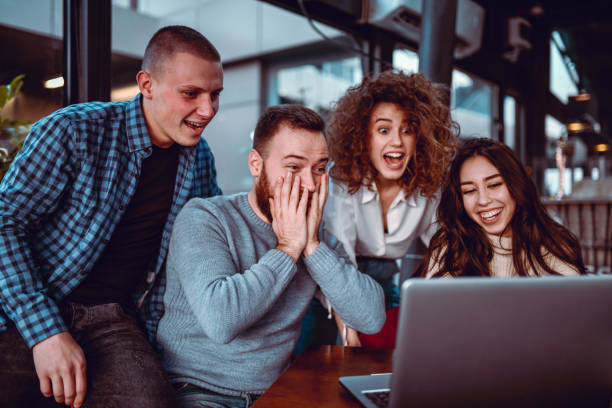 istock Friends Watching Shocking Video Scene Together On Laptop 1287840072