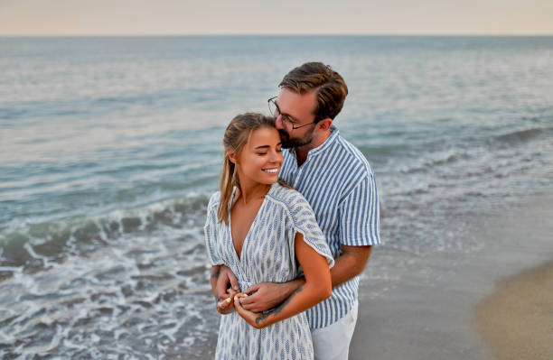 istock Couple on the beach. 1287840249