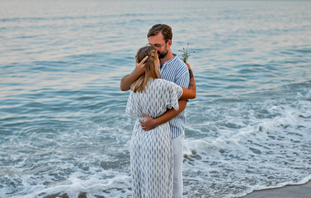 istock Couple on the beach. 1287840309