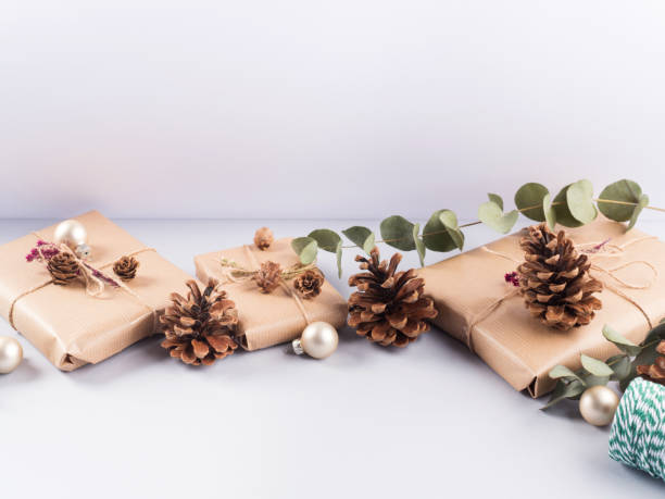 istock Christmas festive wrapped presents, pine cones 1287840597