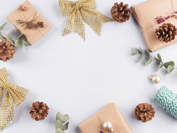 istock Christmas festive frame with presents, bows, pine cones 1287840598