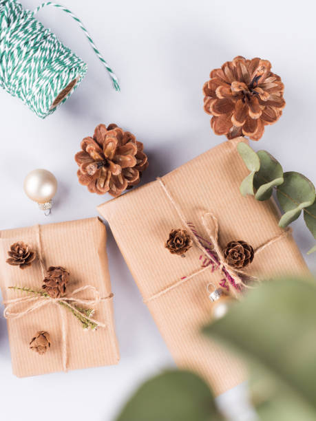 istock Christmas festive wrapped presents, pine cones 1287840603