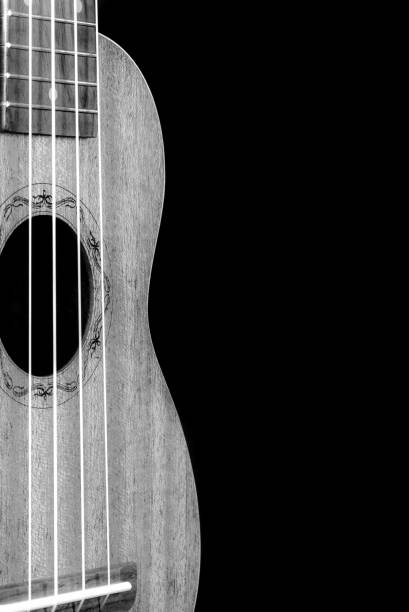 istock Guitar ukulele perspective view close up black and white 1287843344