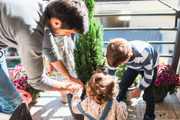 istock Children helping single father with plants 1287843741