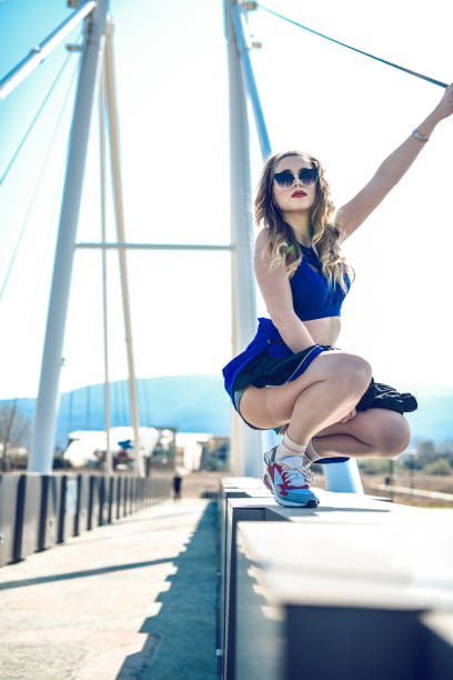istock Female Beauty Dancing And Standing On Bridge Edge 1287844961
