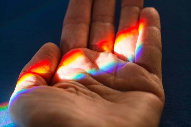 Rainbow in a hand stock photo
