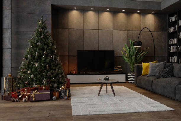 istock Evening At Modern Living Room With Gray Colored Sofa, Spotlights, Television Set, Gift Boxes And Christmas Tree With Ornaments. 1287846136