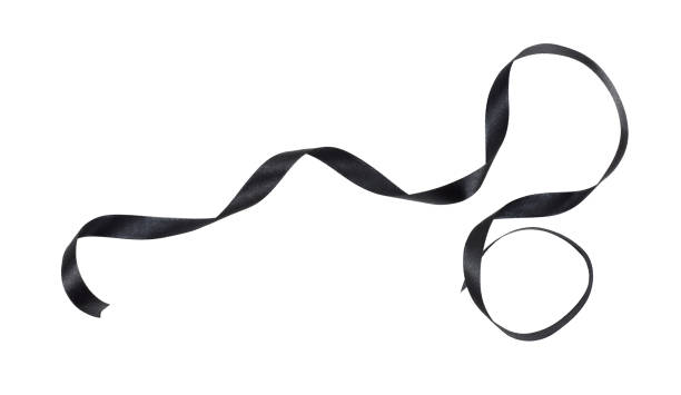 Waved black silk ribbon isolated on white