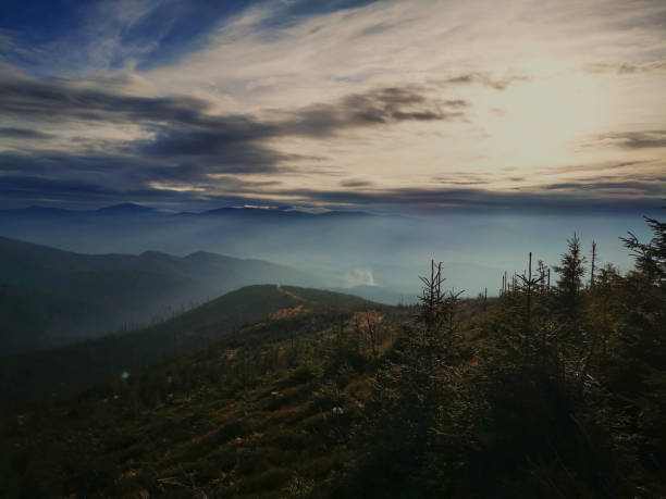 istock Fog over a mountain valley. Autumn in the mountains. 1287847032