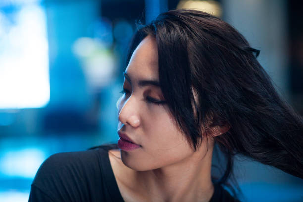 istock Filipina transgender with eyes closed at night 1287852175