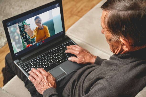 istock Online greetings for an elderly senior a merry christmas 1287854232