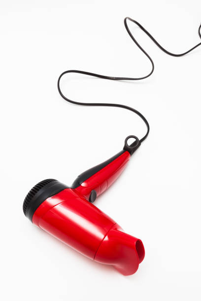 istock beautiful red hair dryer on a white background 1287854380