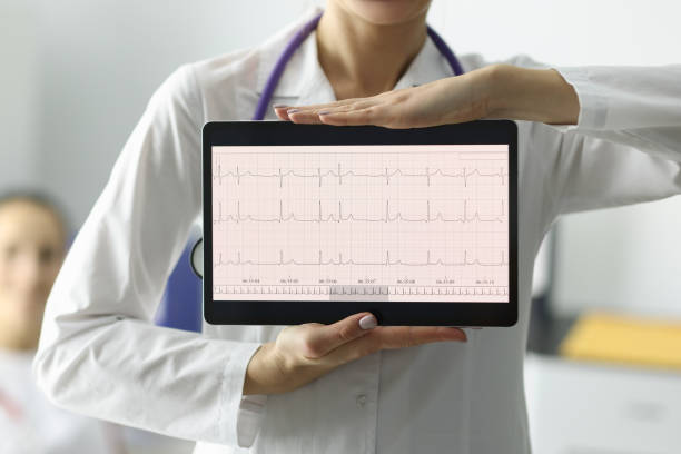 istock Doctor holding tablet with electrocardiogram in clinic closeup 1287855821
