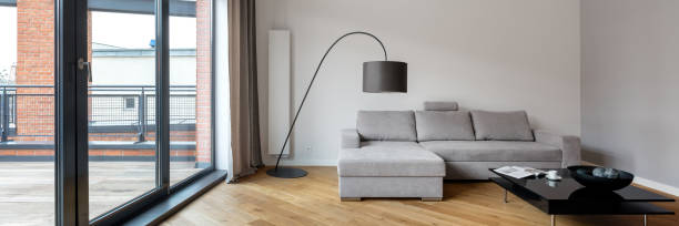 istock Simple living room with terrace, panorama 1287855950