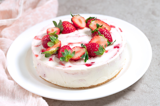 Classic cheesecake with fresh strawberries. Selective focus.