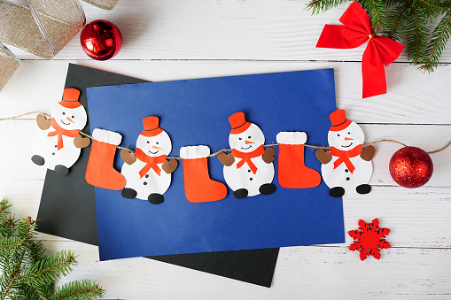 Step-by-step photo instruction of christmas garland with snowman. handmade for children. DIY concept. Step 3