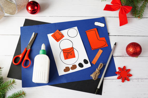 Step-by-step photo instruction of christmas garland with snowman. handmade for children. DIY concept. Step 2 Step-by-step photo instruction of christmas garland with snowman. handmade for children. DIY concept. Step 2 Holiday Scissor Skills Exercise stock pictures, royalty-free photos & images