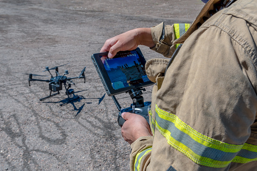 San Rafael, Argentina, november 6, 2020:Drone remote control in hand man.Man operating of flying drone