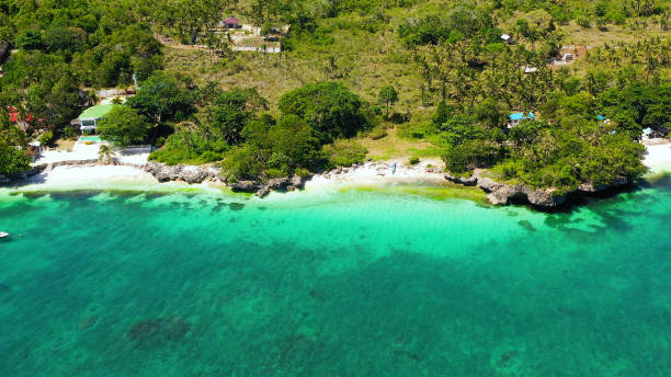 istock Coast with a beach and blue sea. Anda Bohol, Philippines 1287863605