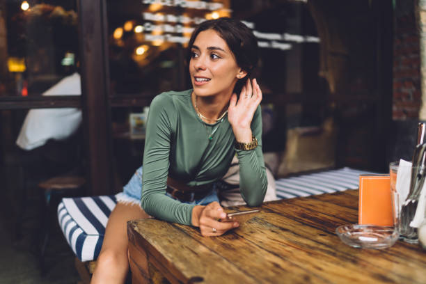 istock Pensive woman at wooden table 1287864035