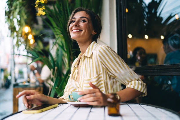 istock Smiling woman enjoying coffee break 1287864087
